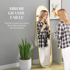 Grand miroir sur pied ovale doré